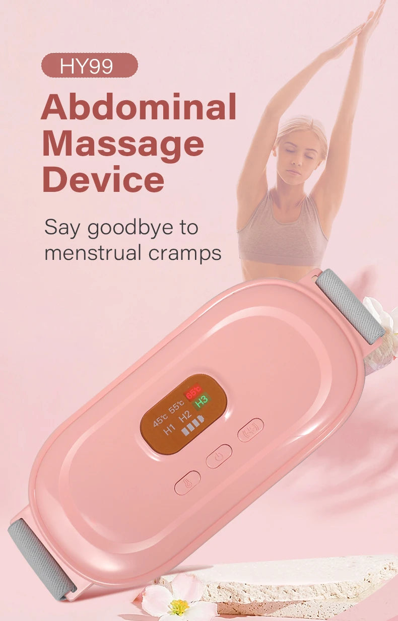 A pink heated abdominal massage device is shown next to a flower and a piece of fabric.