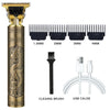 A professional cordless electric hair clipper with a gold and black body, cleaning brush, and USB cable.