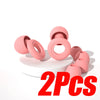 Two pink silicone noise-canceling earplugs are shown on a white surface.