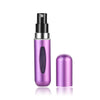 A silver and purple portable mini perfume refill spray bottle with a black cap and a separate purple glass bottle.