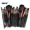 A collection of 22 professional makeup brushes with synthetic bristles displayed on a white background.