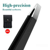 A close-up view of a black precision stainless steel eyebrow grooming tool.