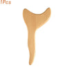 A light wood gua sha roller tool for facial massage and detoxification.