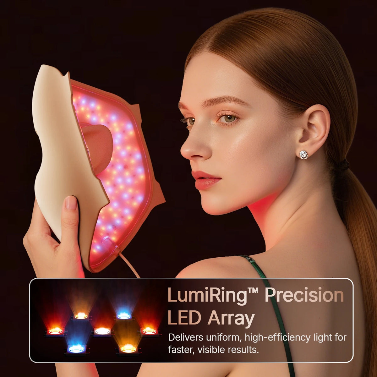 A woman holds a LumiRing Precision LED Array light therapy mask, showing the uniform light output on her face.