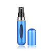 A blue portable mini perfume refill spray bottle with a black cap and a separate blue refill component.