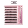 A pink tray containing a DIY lash extension kit with bond, seal, and remover tools.