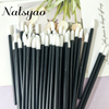 A set of 50 black and white disposable lip applicator brushes displayed on a light background.