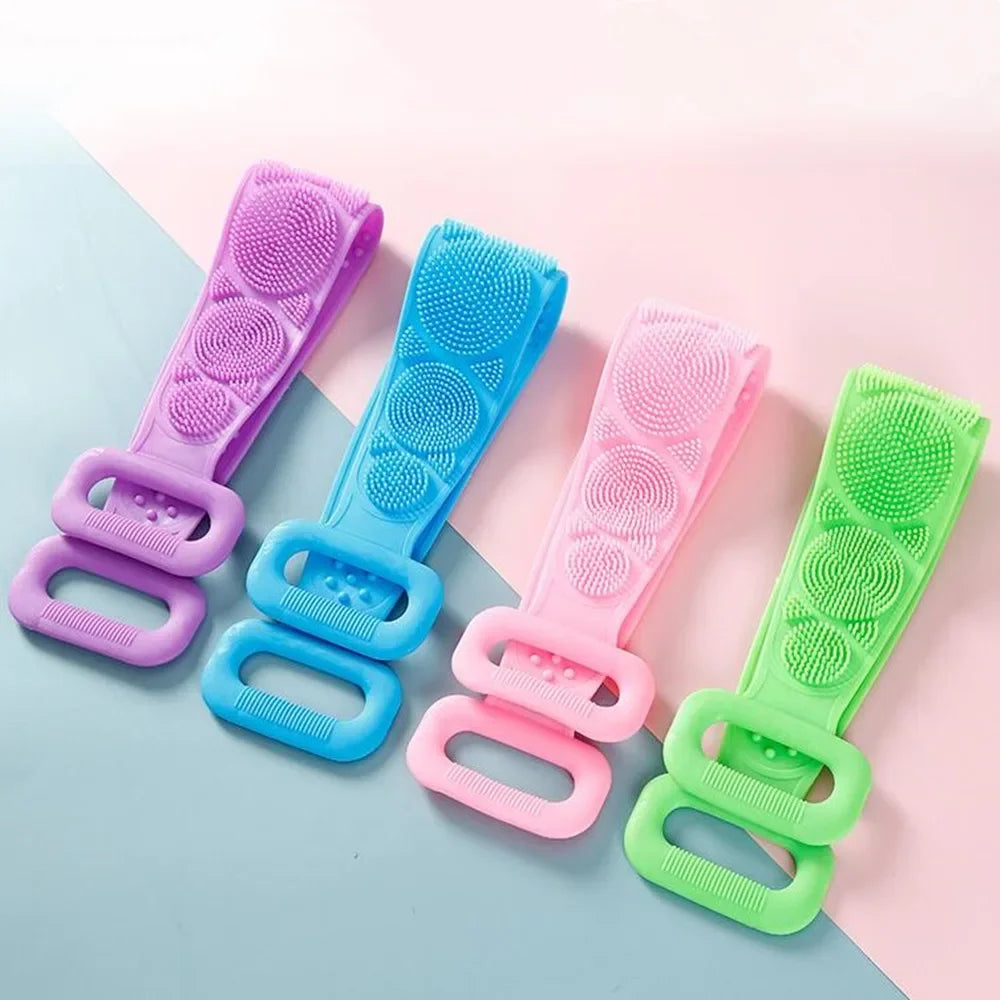 A set of five silicone dual-sided body scrub and exfoliating brushes in various pastel colors laid on a light pink and blue b