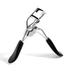 A silver makeup eyelash curler with black handles shown from the side.