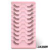 A pink plastic tray holding a set of clear band cat eye false eyelashes.