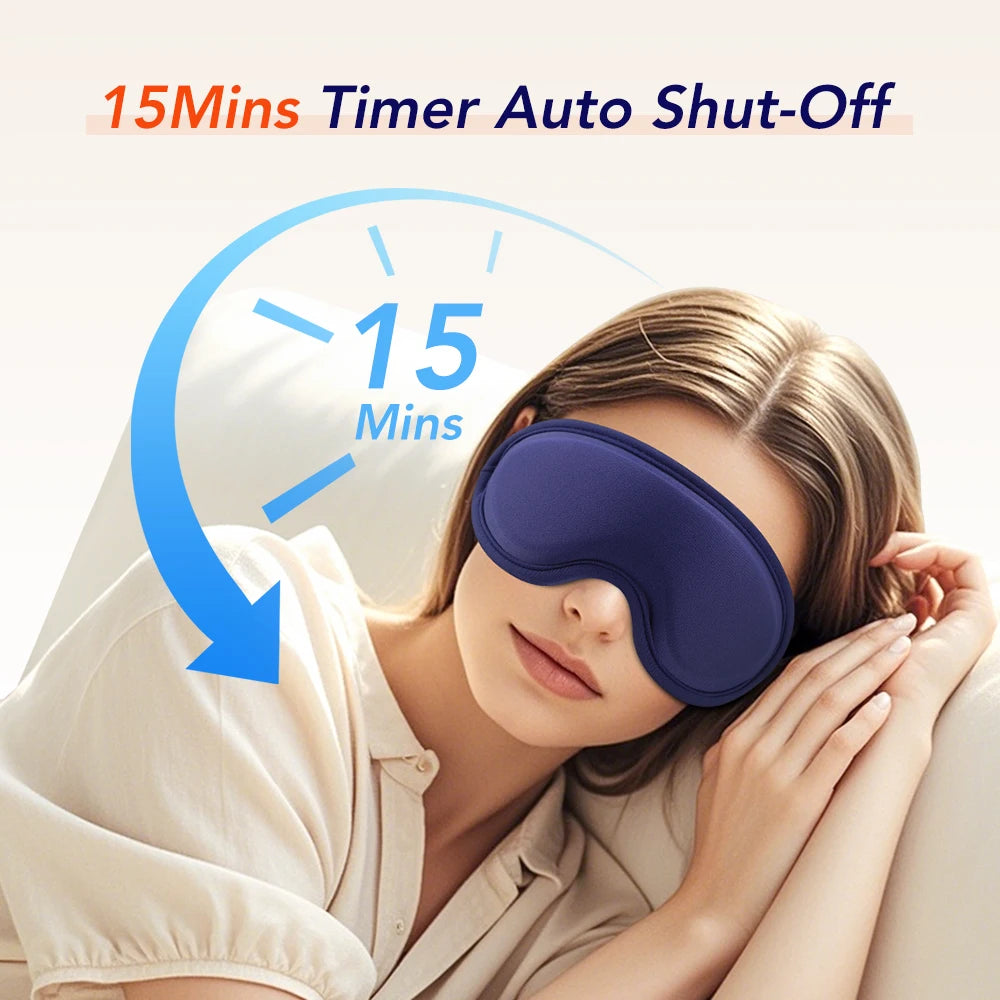 A woman is using a purple electric heated eye mask with a timer set for 15 minutes.