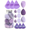 A collection of 15 purple makeup sponges in various shades and shapes displayed in a glass jar.