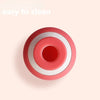 A pink and white facial toner jaw exerciser with concentric circles.