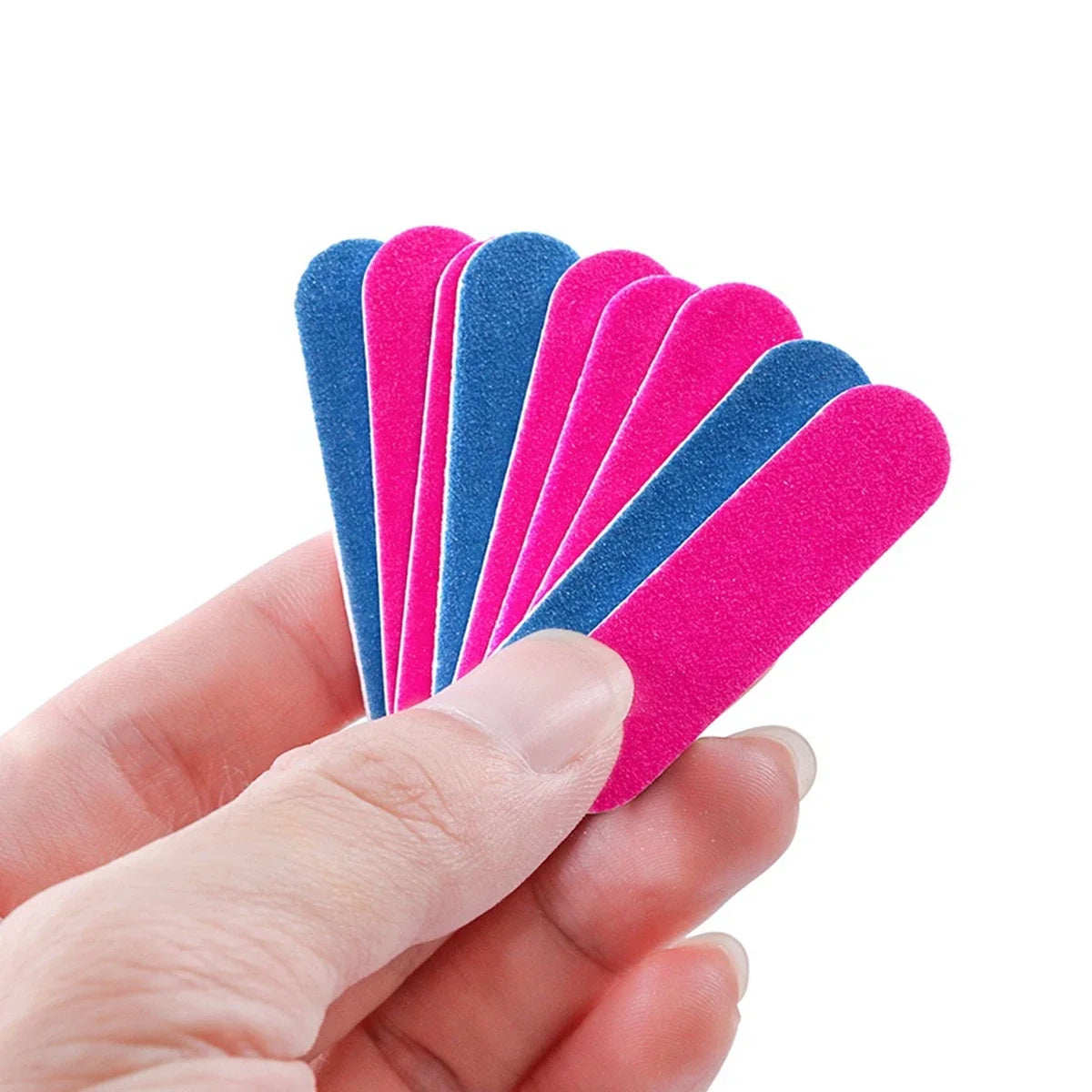 A hand holds a set of double-sided mini nail files in various shades of pink and blue.