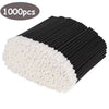 A bundle of black and white disposable lip wands for gloss and lipstick.