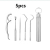 A set of five reusable aluminum toothpicks for oral cleaning, including a long pick and four slender picks.