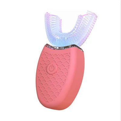 A pink electric toothbrush with a clear silicone head and a textured pink body.