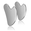 Silver stainless steel gua sha tool for facial and body massage shown with a reflection.