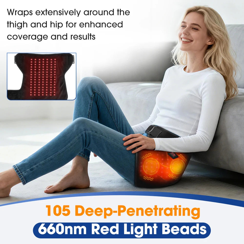A woman is using an infrared heat and vibration hip massager belt, which wraps around the thigh and hip area.