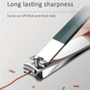 A close-up of a professional stainless steel nail clipper being used to cut nails.