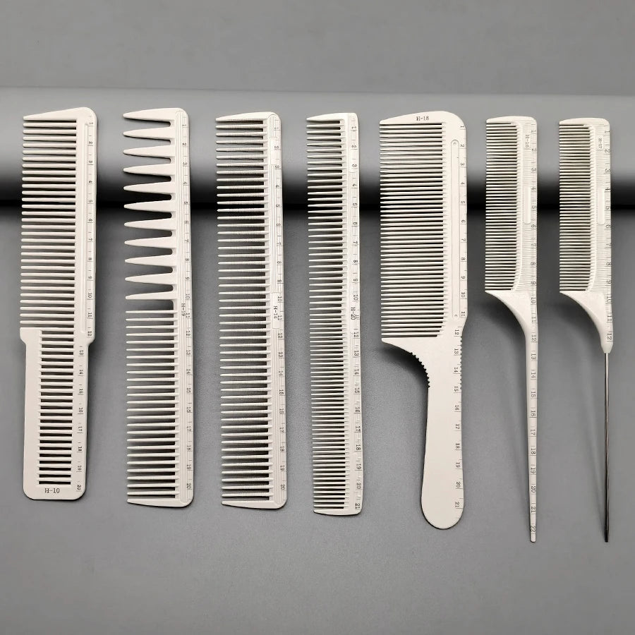 A set of seven white professional hair styling combs displayed in a row against a gray background.