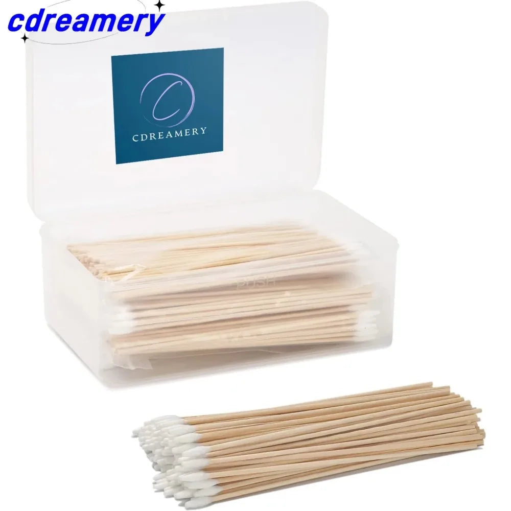 A clear box containing numerous precision wooden cotton swabs.