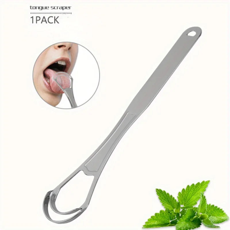 Un rasp de langue en acier inoxydable à côté d'une tige de menthe pour l'hygiène buccale.