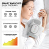A woman is using a gray electric hand massager for therapy while lying in bed.