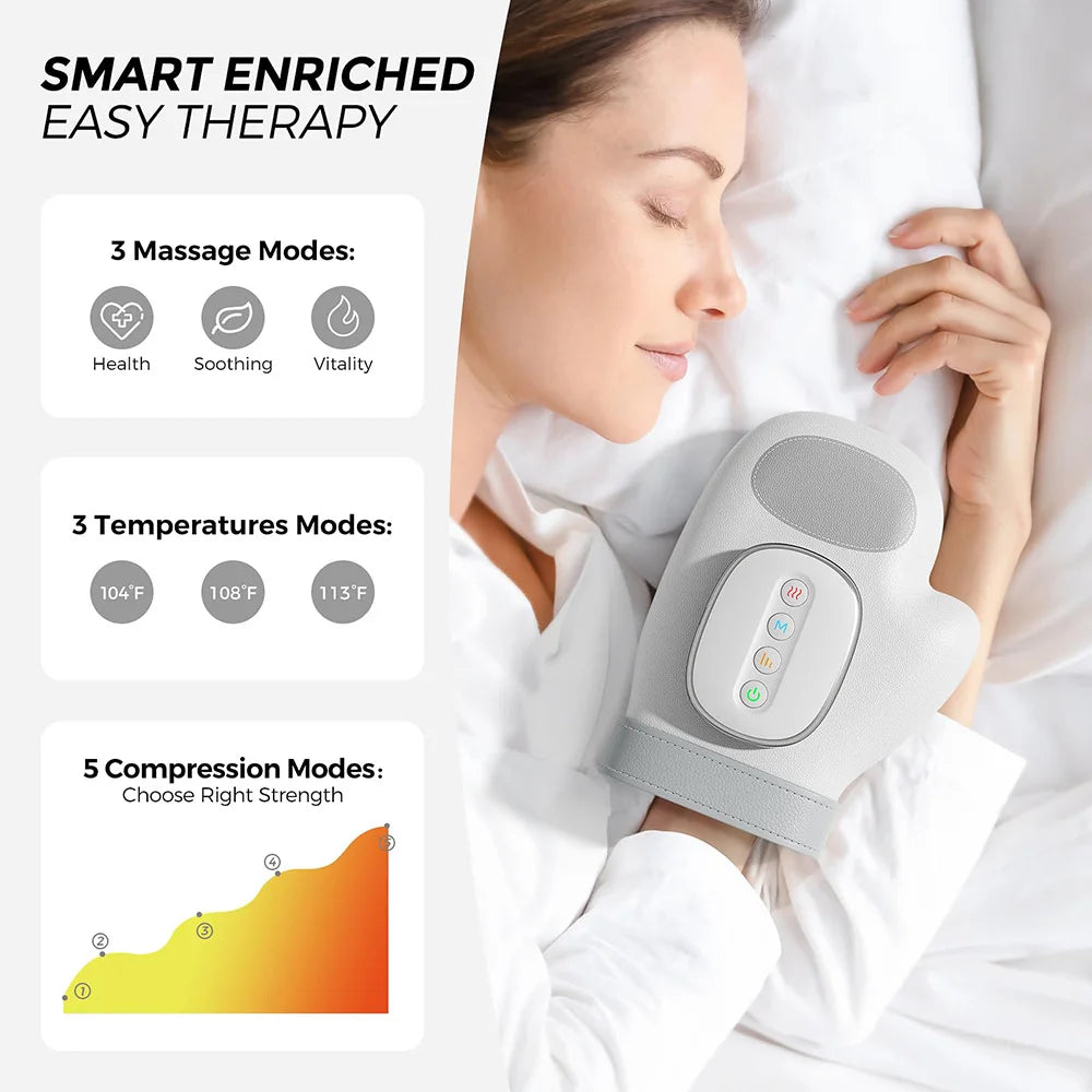 A woman is using a gray electric hand massager for therapy while lying in bed.