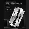 A silver double edge razor blade with a platinum figdear handle displayed on a dark background.