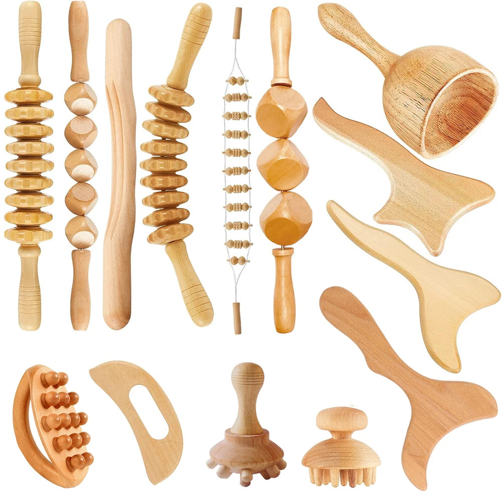 A collection of natural wood gua sha rollers and tools for facial massage and skincare.