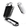 A silver folding mini hair comb with a black comb and mirror for styling.