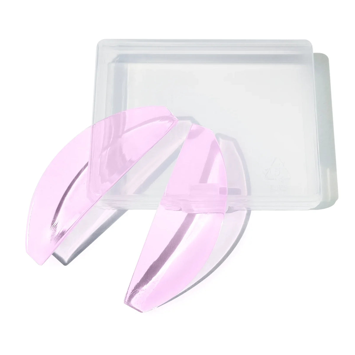 Clear silicone lash lift pads in a plastic container with pink silicone pads visible.