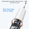 A close-up of a white smart ultrasonic tooth cleaner device with a black control panel and a clear cleaning tip.