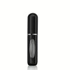 A sleek, black mini refillable perfume atomizer bottle with a silver band.