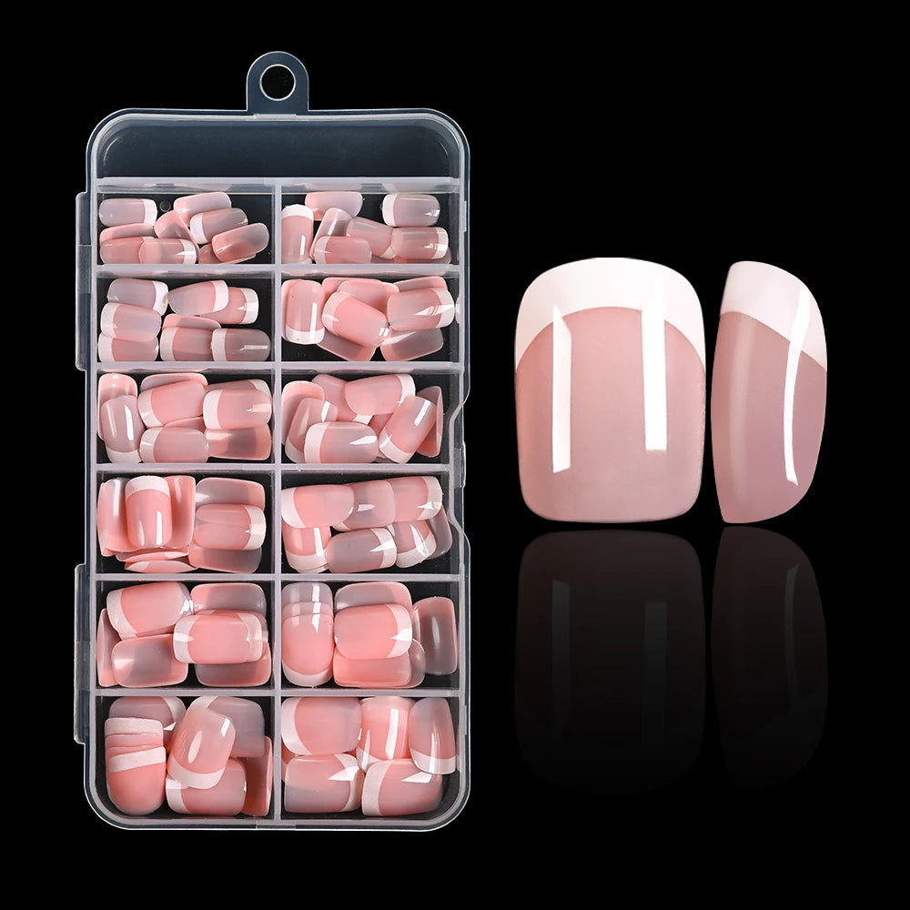 A clear plastic container holding nude pink press-on nails with white French tips.