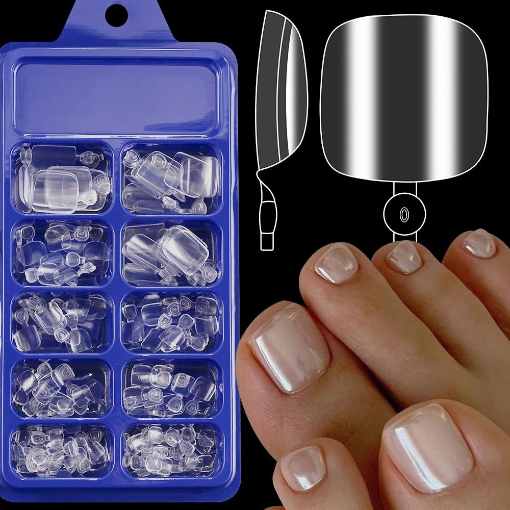 A set of clear silicone press-on rings for toenails displayed next to a silver ring and a hand.