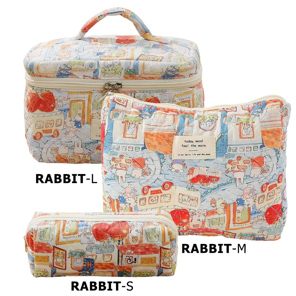 Three sizes of quilted cotton makeup bags featuring colorful floral patterns and fabric patches.