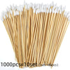 A bundle of 1000 precision wooden cotton swabs with white tips arranged diagonally.