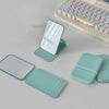 A set of portable makeup mirrors in mint green and white, including a folding mirror and several rectangular mirrors.