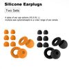 Collection de bouchons d'oreille en silicone orange et noir, différentes tailles pour divers conduits auditifs.
