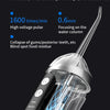 Close-up of a portable oral irrigator device showing water flow and pulse technology.