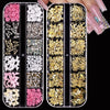 A set of 24 pieces of 3D Y2K nail art decorations including rhinestones, pearls, and charms in various colors.