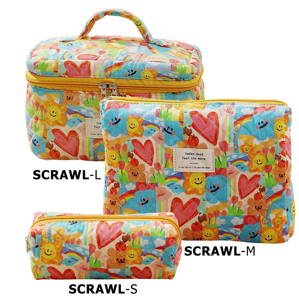 A set of three colorful quilted cotton makeup bags in various sizes labeled SCRAWL-L, SCRAWL-M, and SCRAWL-S