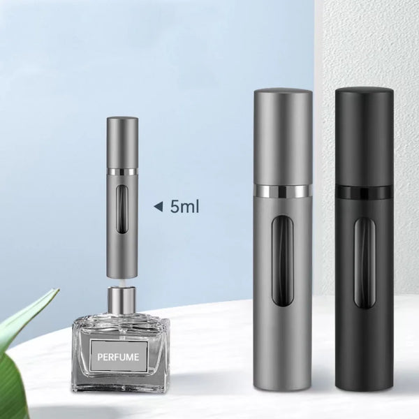 A glass refillable perfume bottle with a spray pump shown next to two metal-colored perfume bottles.