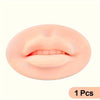 A close-up view of a pink reusable silicone practice skin for tattoo art, showing the texture and shape of human lips.