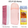 A pink wax warmer and a yellow bottle of honey for professional waxing.
