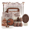 A collection of makeup brushes and tools, including various sizes and types, displayed in a brown washbag.